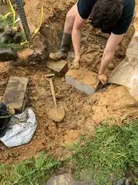 Image 7. Pack in the cinder blocks with rocks, gravel, and clay-- seal and build it all with a clay mixture.