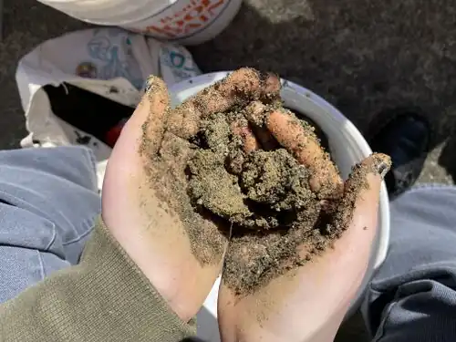 We chose to hand mix the cob to save money, which ended up being a very messy intense part of the project.