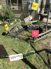 Image 1: Pond modeling the retaining wall, spillway, aeration system, possible signage (yellow) and solar panel (red) positioning.