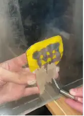 A prototype for the magnetic sands section of the exhibit, showcasing function of the magnetic sand (iron filings) attracting to a movable magnetic grid.