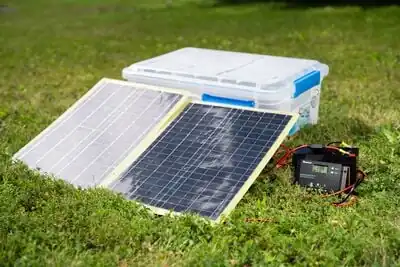 Photo of solar panels propped against a bin with panels tilted at 26 degrees to optimize their performance in Arcata, CA during summer months